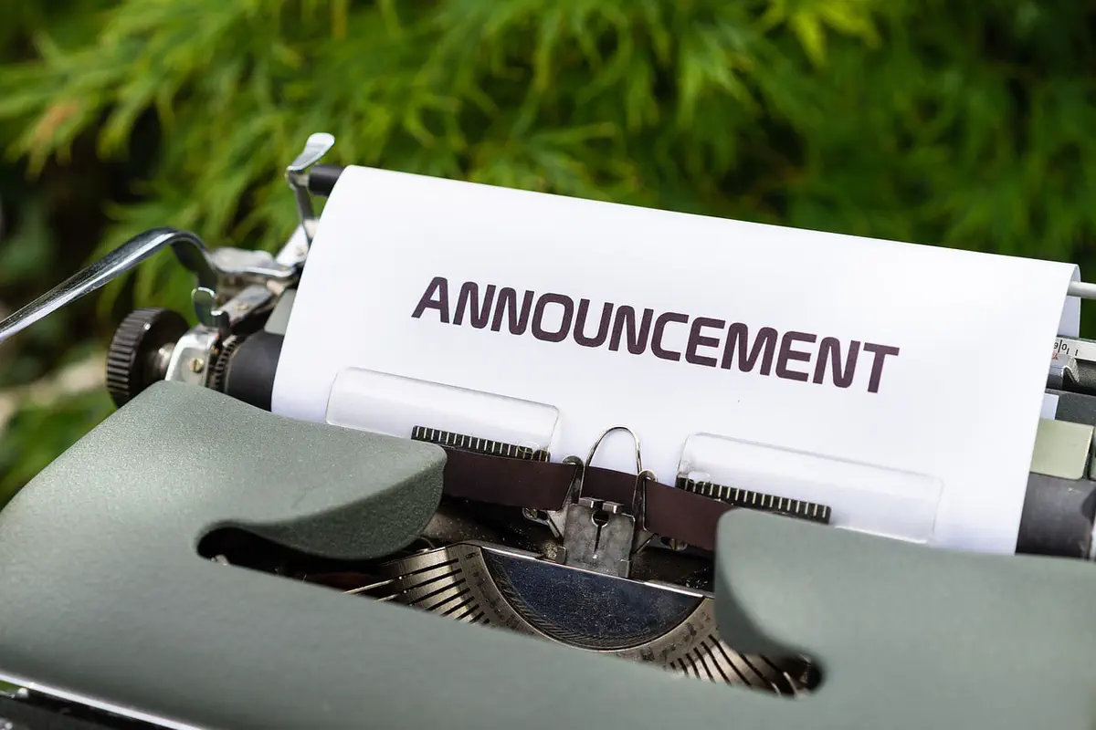Paper with heading 'Announcement' fixed in an old mechanical typewriter.